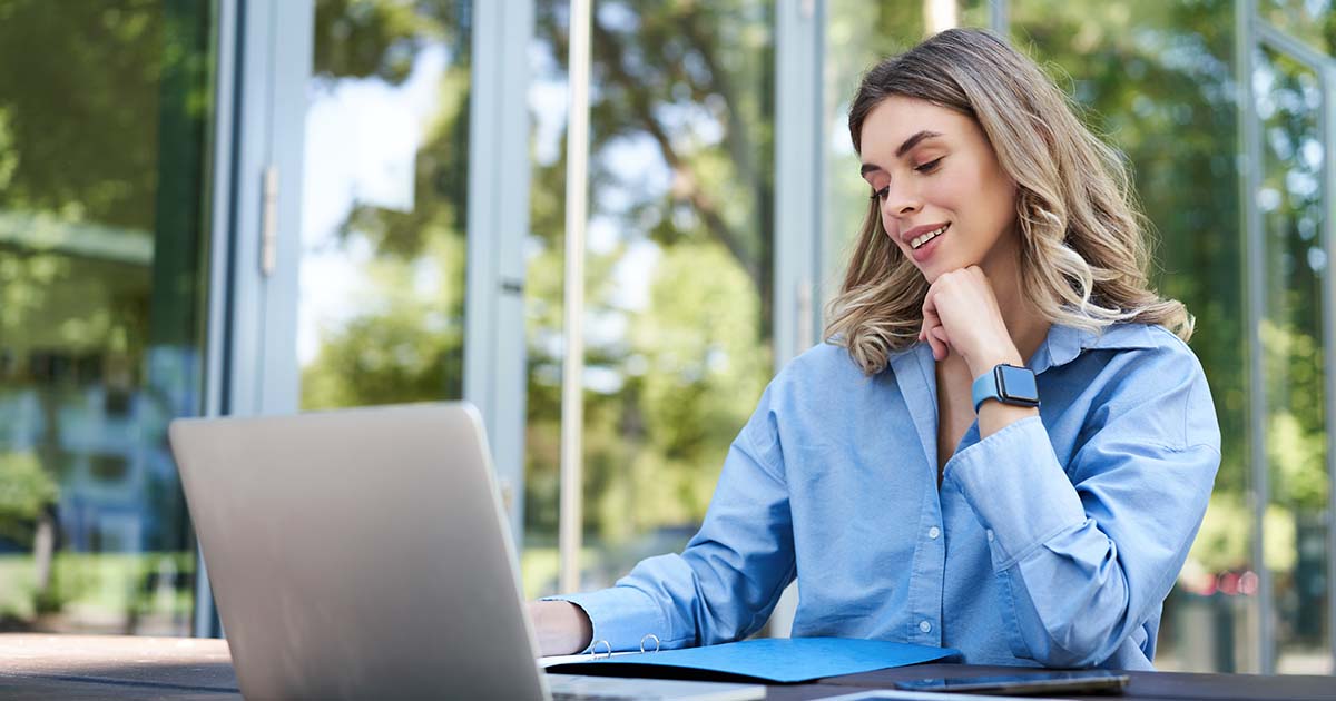 woman outdoors using laptop